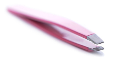 Pink stainless steel grooming tweezers on white background